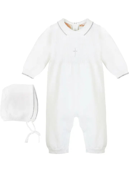 White baby onesie and bonnet set on a white background