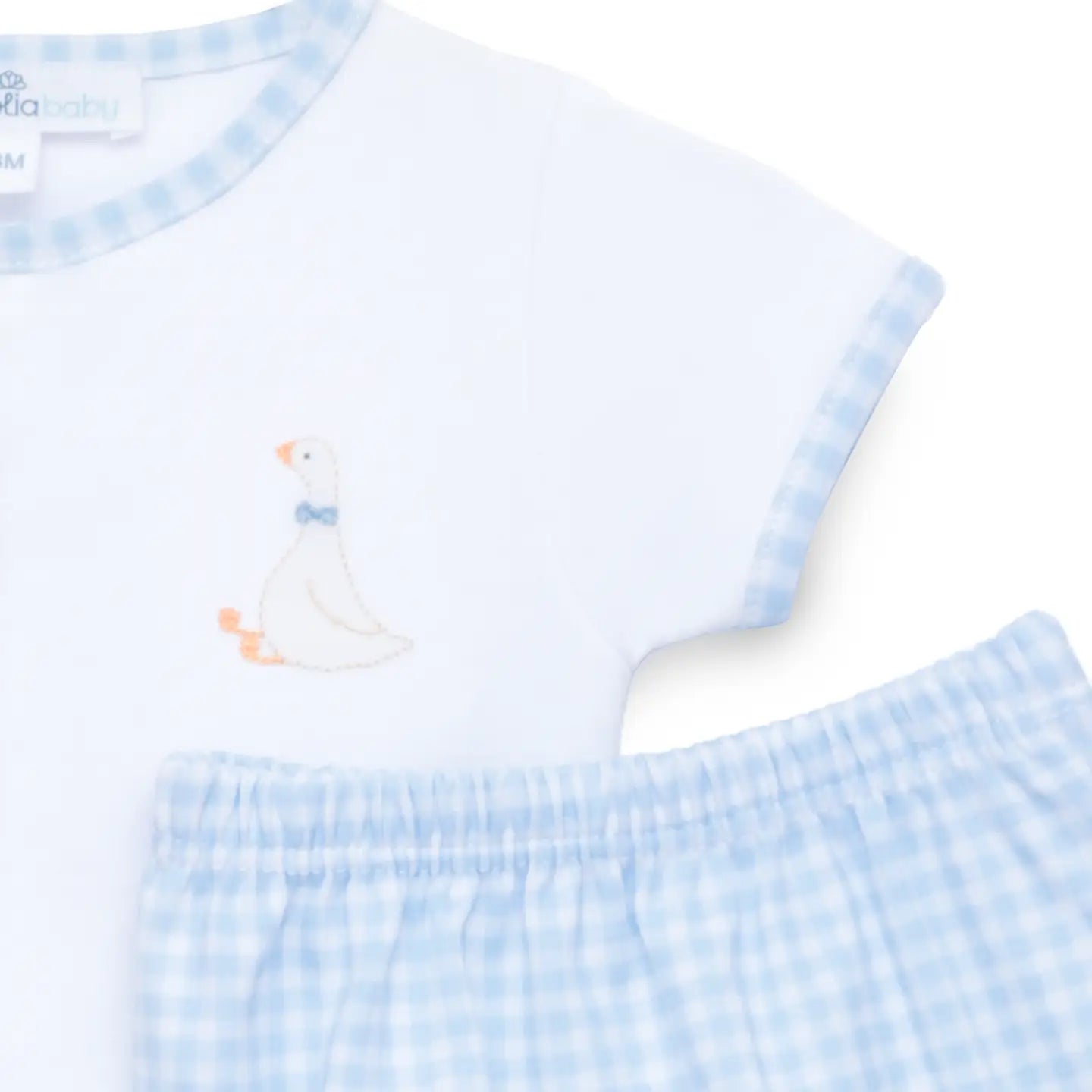 Baby outfit with white shirt and blue checkered pants featuring a duck design on a white background.