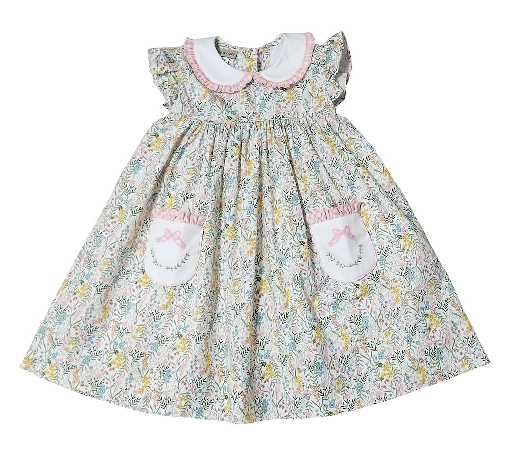 Floral dress with embroidered details on a white background