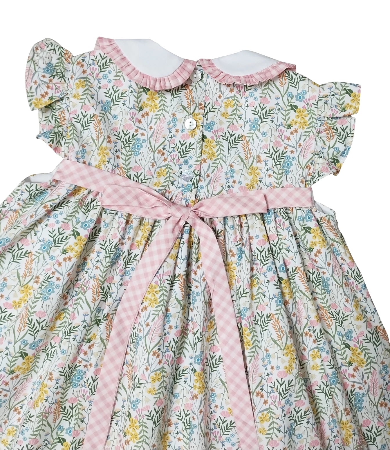 Floral dress with a pink belt on a white background