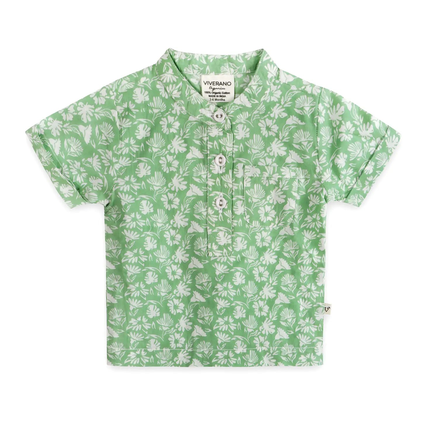 Green shirt with white floral pattern on a white background