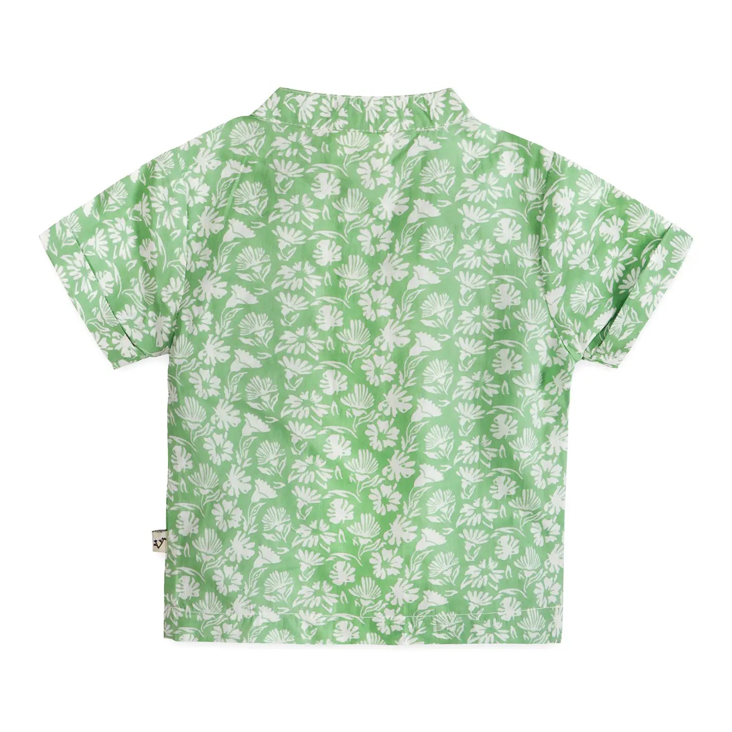 Green shirt with white floral pattern on a white background